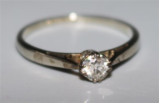 An 18ct gold and platinum solitaire diamond ring, size L.